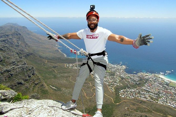Abseiling Table Mountain - The abseiling moment: harness, rope connection, and a long look at the drop
