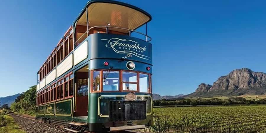Cape Town: Franschhoek Wine Tram Hop-On Hop-Off Tour - Cape Town pickup, a small-group pace, and Paul Polano Tours support