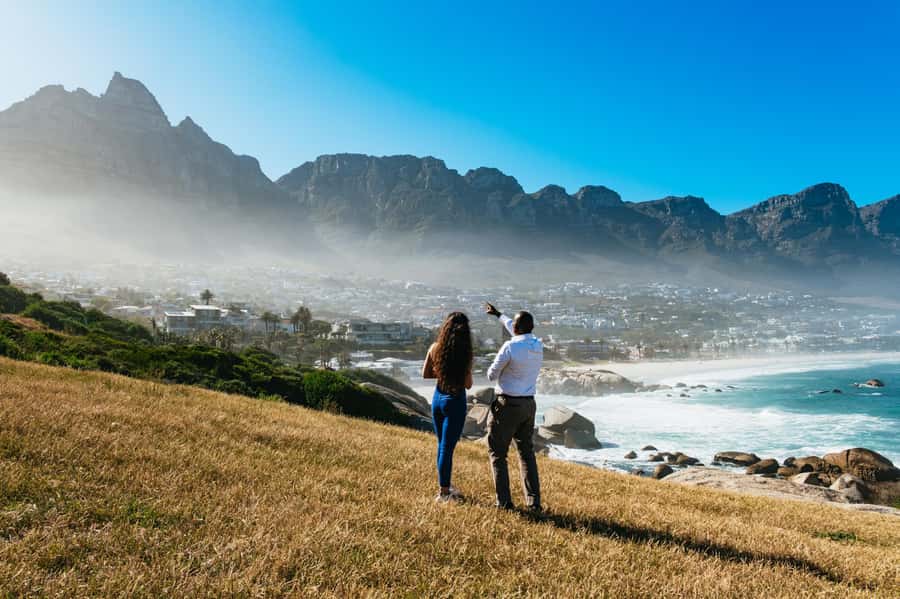 From Cape Town: Cape Peninsula & Boulders Penguin Beach Tour - Hout Bay and Duiker Island: mountains, sea, and a chance to go by boat