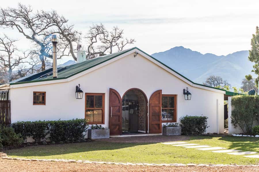 From Cape Town: Franschhoek Vineyards Bike Tour with Lunch - French Huguenot vineyards and the Huguenot Memorial pause
